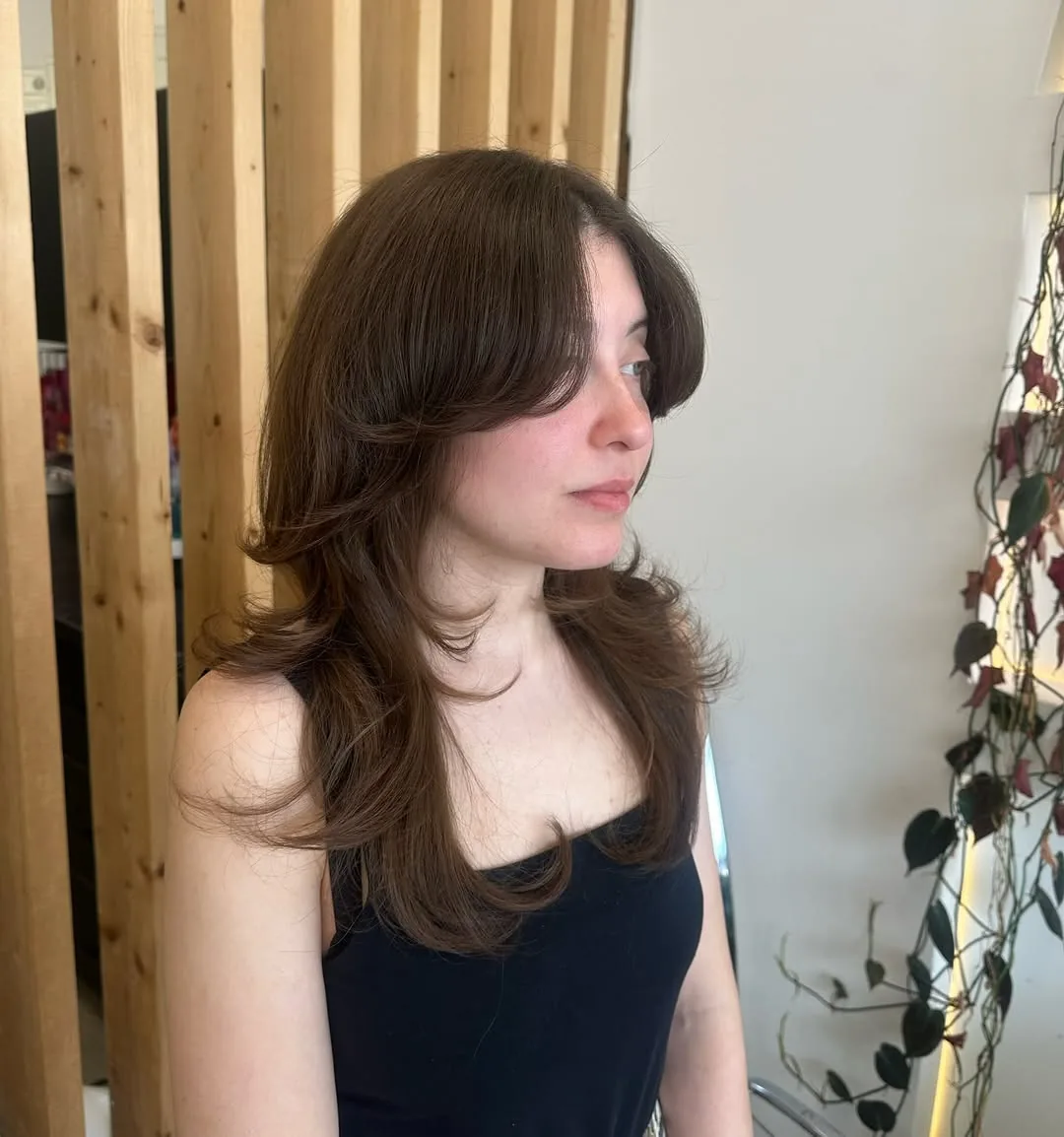Medium shag haircut: classic medium shag with curtain bangs