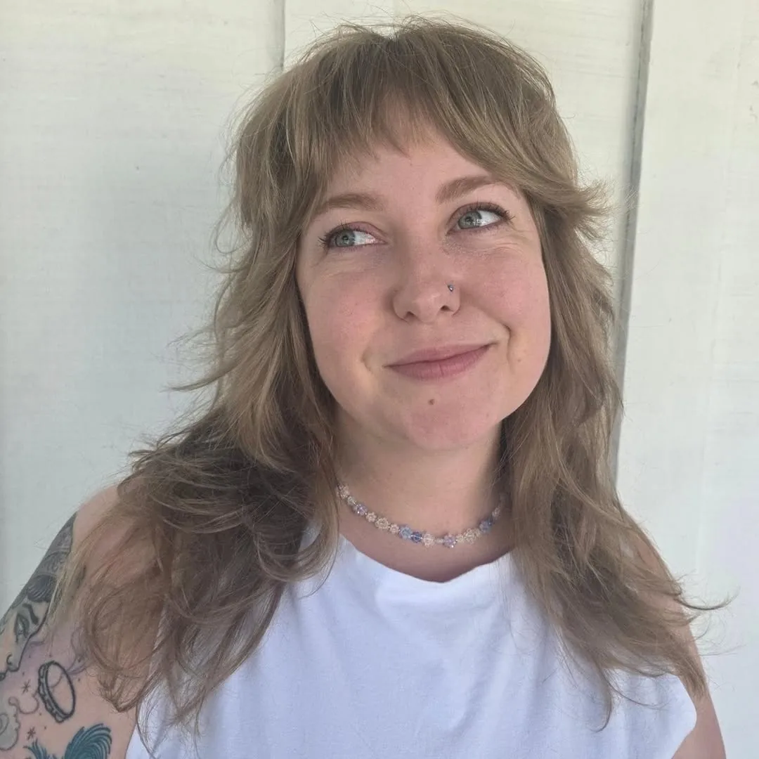 Medium shag haircut: wavy shag with tousled texture