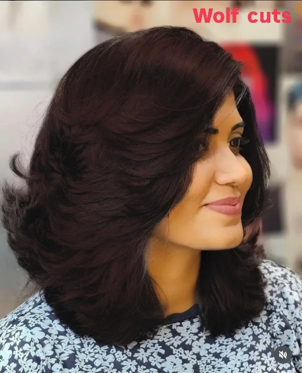 Copper wolf cut medium hair with voluminous reddish layers