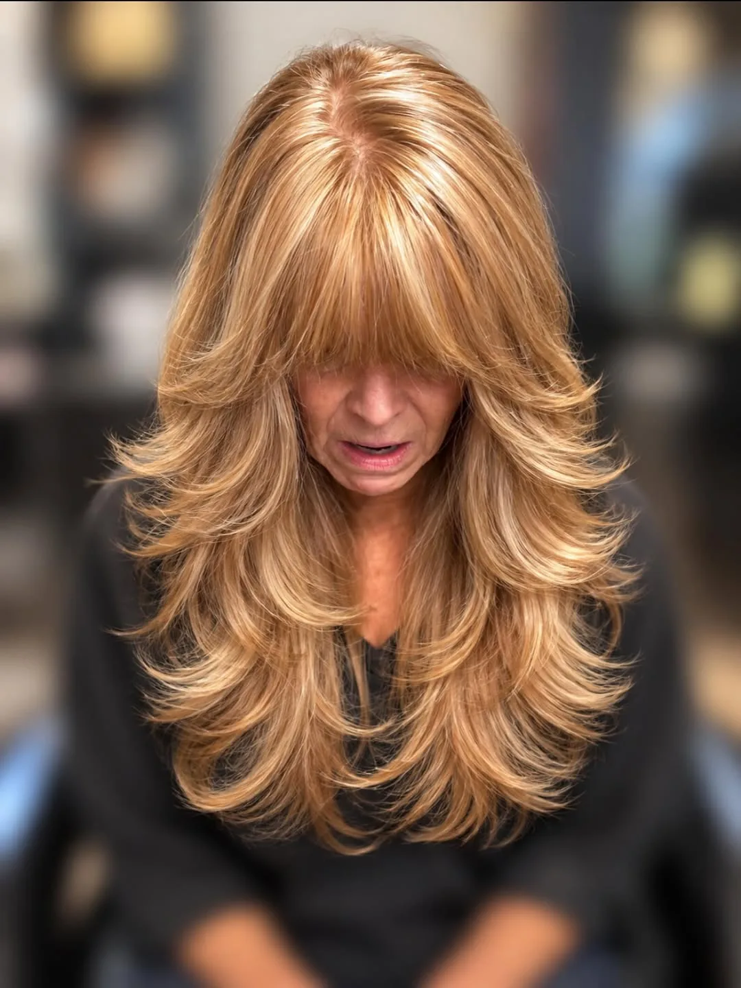 Blonde wolf cut medium hair for thick hair with feathered razored layers