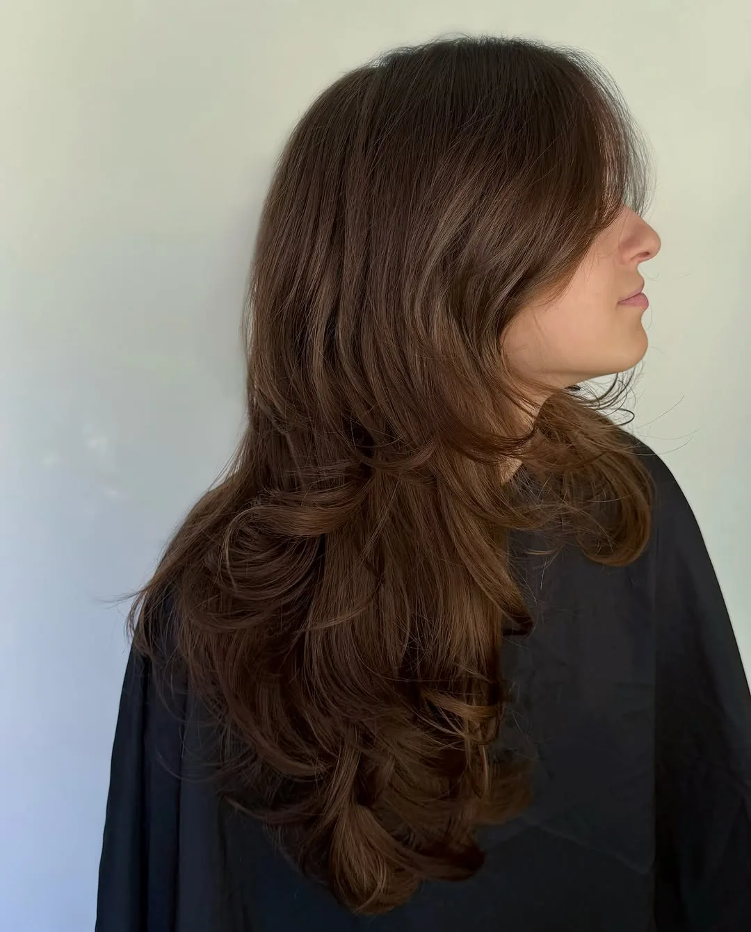 Wolf cut medium hair with side swept bangs and flipped layers